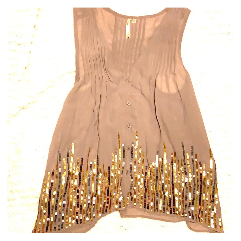 Sheer sleeveless blouse with metallic sequins